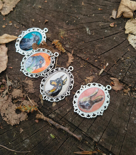 Hand-painted pendants by Fauna Witch